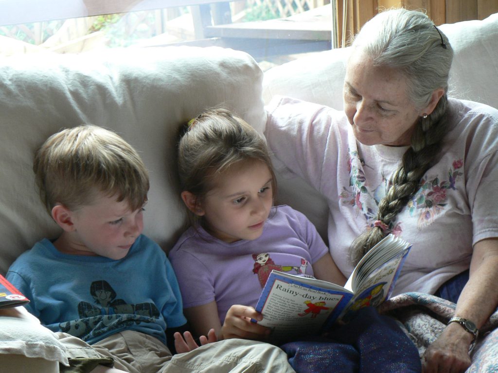 Students read to teacher at Sugarwood School